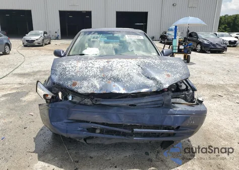 1999 Toyota Camry Le from USA, damaged, VIN 4T1BF28K5XU074652